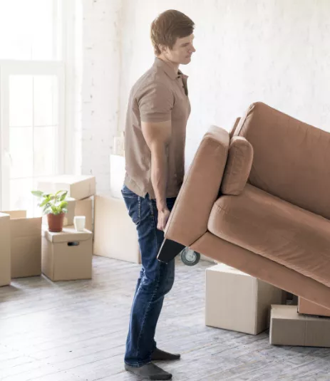 Man lifting a sofa
